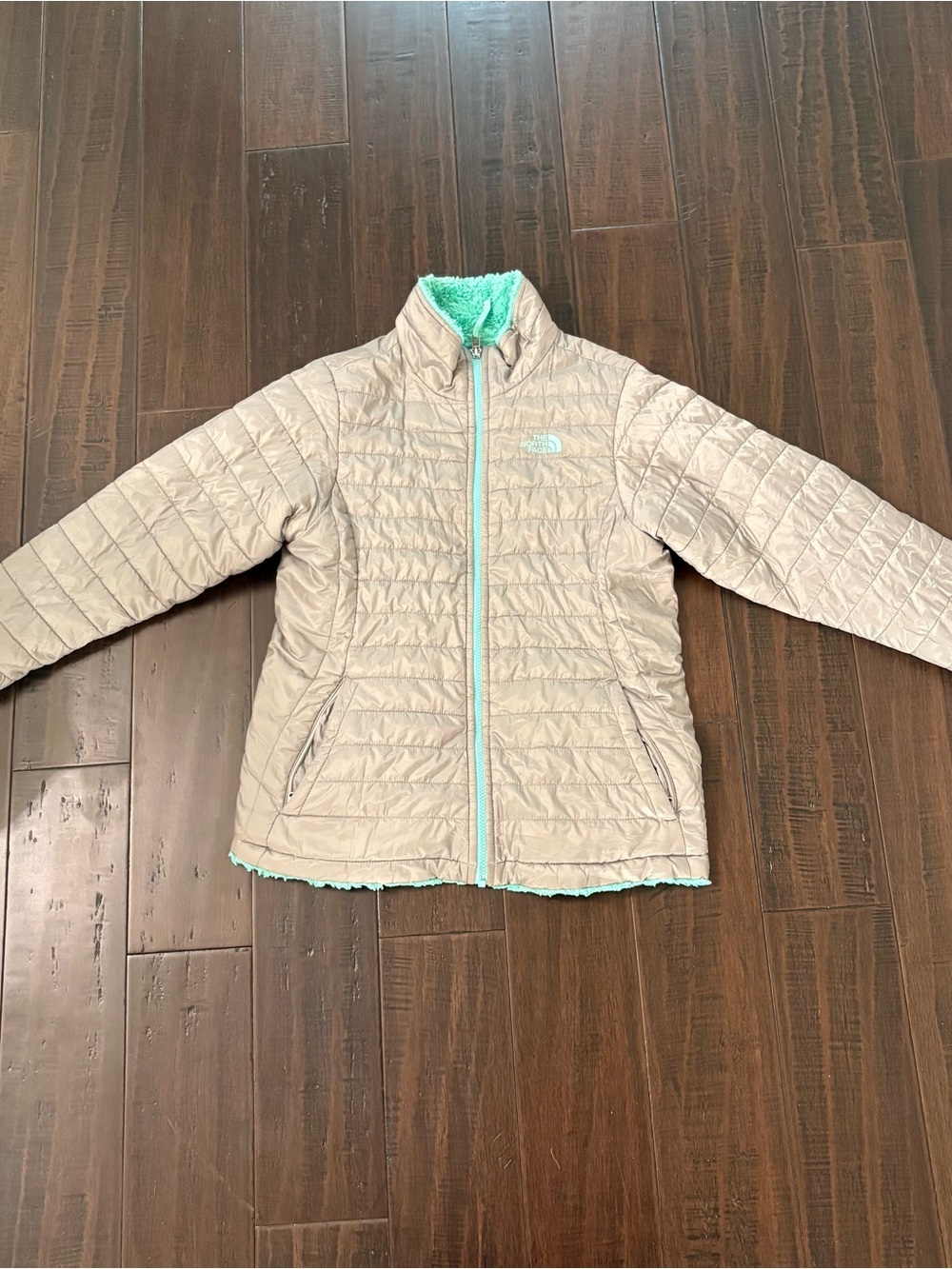 The North Face women’s ' Light Beige Puffer Jacket with Mint Trim